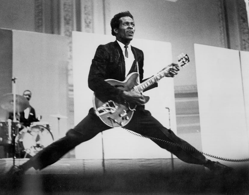 Rock and roll musician and music baby names inspiration Chuck Berry does the splits as he plays his ...