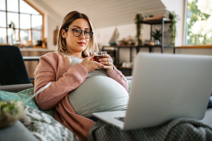Can you take Mucinex while pregnant? Pregnant woman drinks tea at home for sore throat while using h...