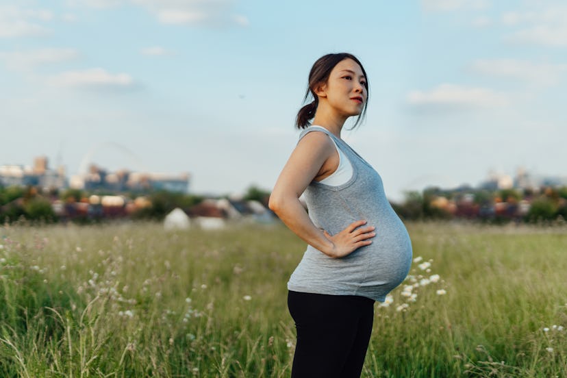 Is Zyrtec safe during pregnancy? A pregnant woman pauses on a jog through a field full of spring flo...
