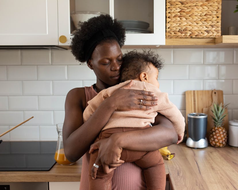 Baby asleep on mums shoulder, sleep regressions