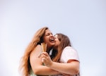 two young women share a kiss after eating ice cream, as they consider how the may 2023 black moon wi...