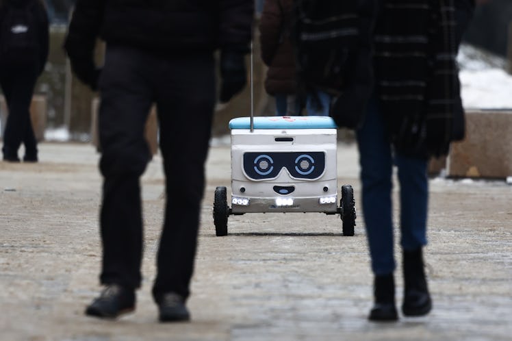 LUBLIN, POLAND - FEBRUARY 10: Food delivery robot named Mateusz ride the street in Lublin, Poland on...