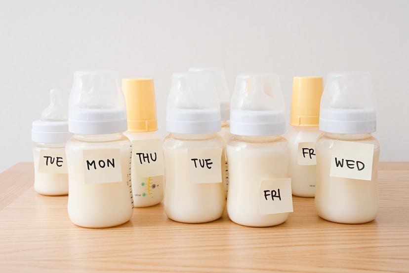 Chilled and labeled baby bottles of pumped breast milk in bottles for the week in article about how ...