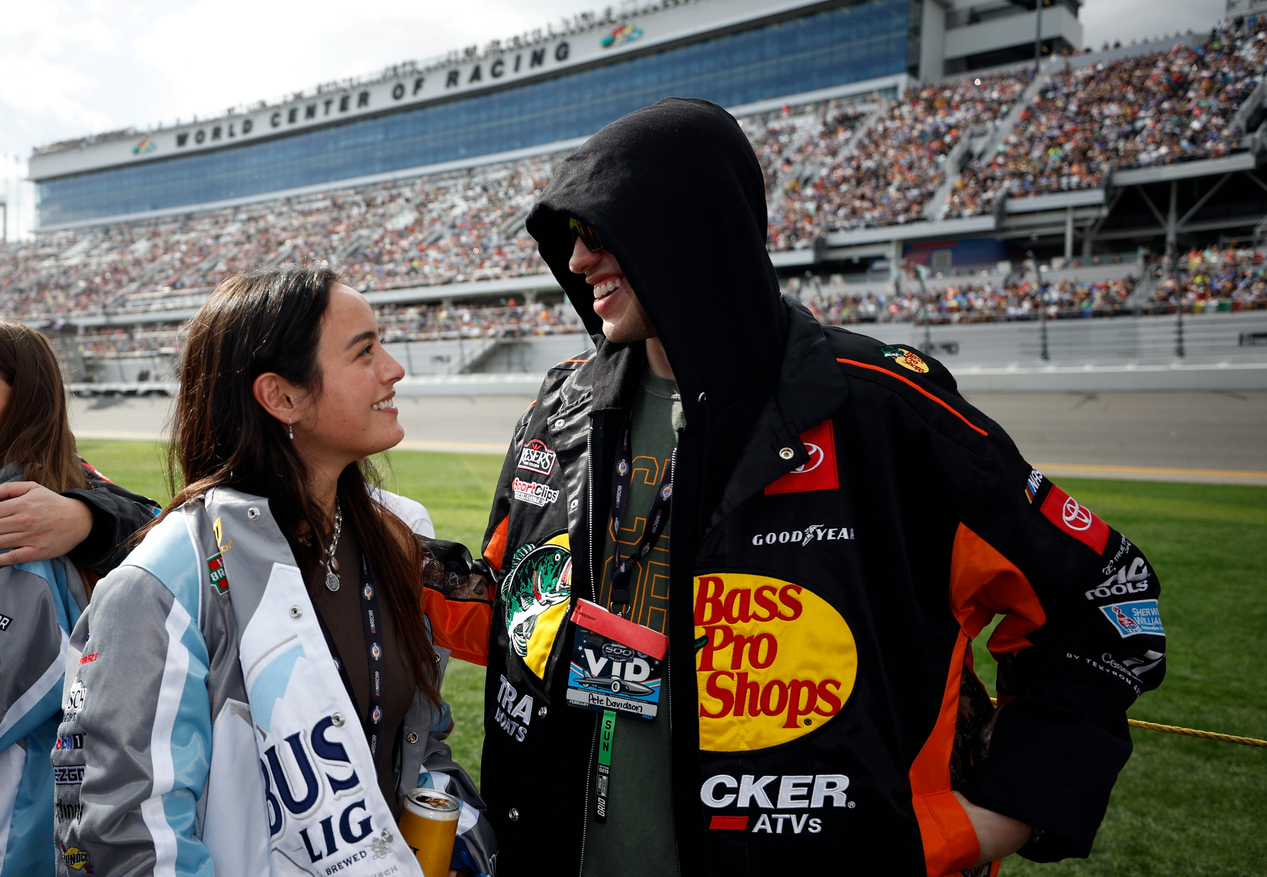 DAYTONA BEACH, FLORIDA - FEBRUARY 19: Pete Davidson and Chase Sui wait on the grid prior to the NASC&hellip;