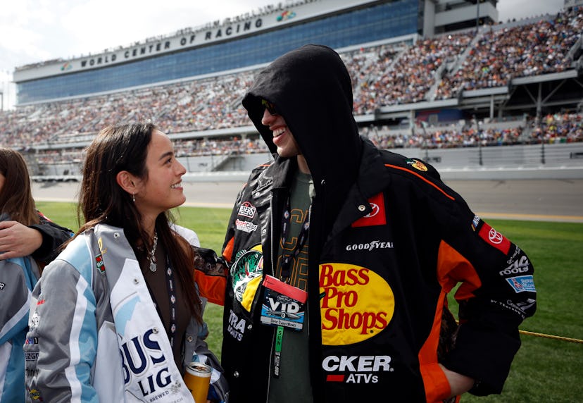 DAYTONA BEACH, FLORIDA - FEBRUARY 19: Pete Davidson and Chase Sui wait on the grid prior to the NASC…