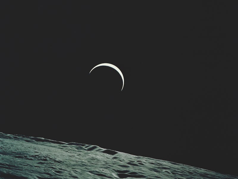 Earthrise over the horizon of the Moon, taken towards the end of NASA's Apollo 15 lunar landing miss...