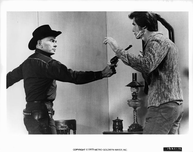 Yul Brynner points a weapon at James Brolin in a scene from the film 'Westworld', 1973. (Photo by Me...