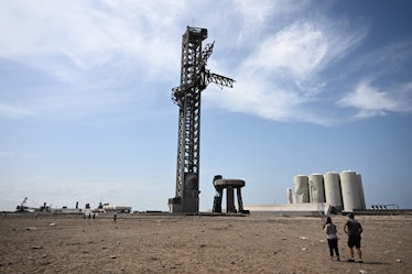 Members of the public walk through a debris field at the launch pad on April 22, 2023, after the Spa...