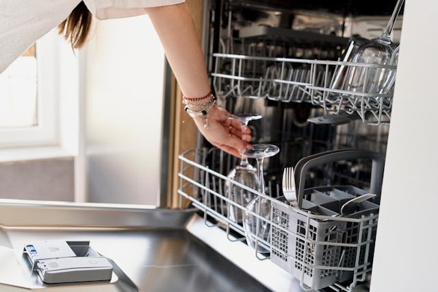 A husband disapproves of wife's dishwasher loading technique