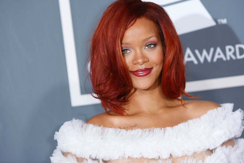 Rihanna wore red hair and a see-through dress to the 2011 Grammys.