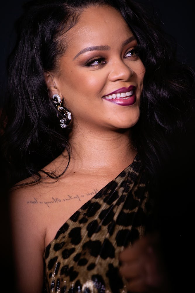 Rihanna purple lipstick and liner at Rihanna book launch (Photo by Lexie Moreland/WWD/Penske Media v...