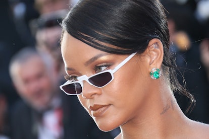 Rihanna wears sunglasses and bronzed eyeshadow at the Cannes Film Festival in 2017.