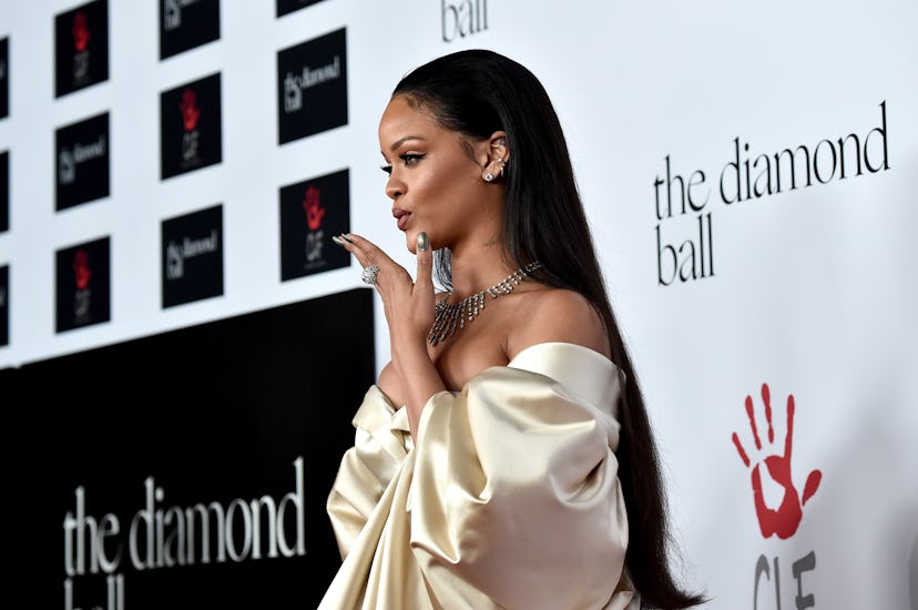 Rihanna hosting the Diamond Ball with sleek hair and shiny highlight.