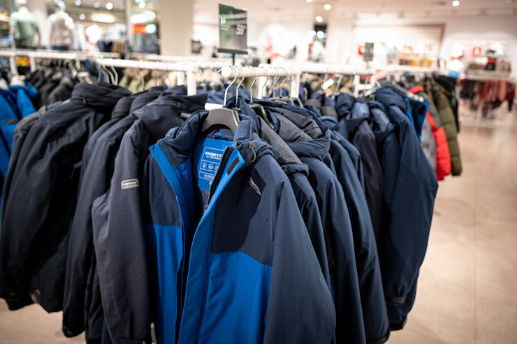 ILLUSTRATION - 02 March 2022, Berlin: Rain jackets hang in the C&A clothing store in a shopping cent...