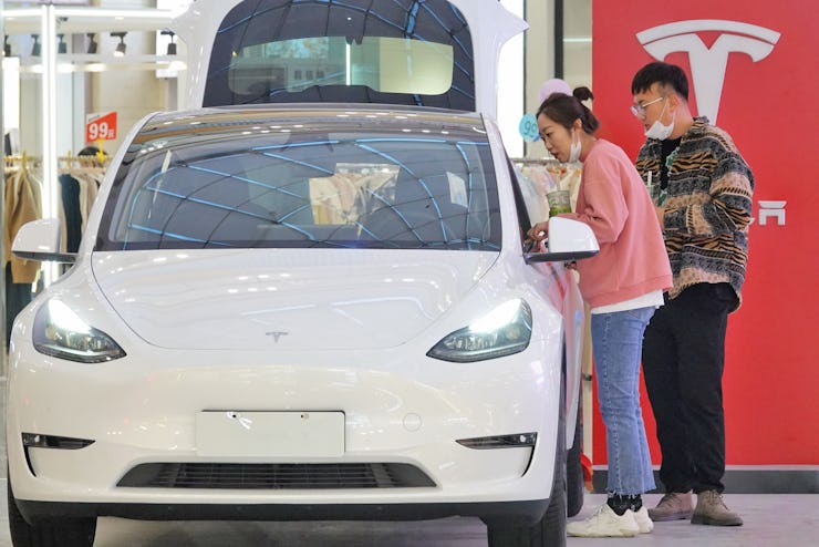 YANTAI, CHINA - OCTOBER 29, 2022 - Customers learn about the Tesla Model Y at a mall in Yantai, Shan...