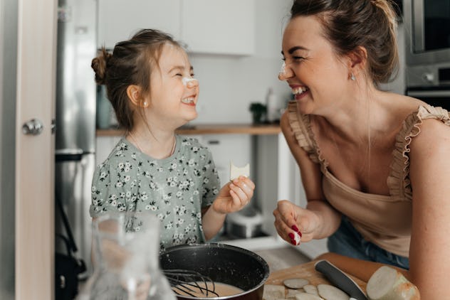 mother and child laughing together at mother's day jokes