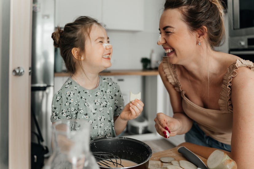 mother and child laughing together at mother's day jokes