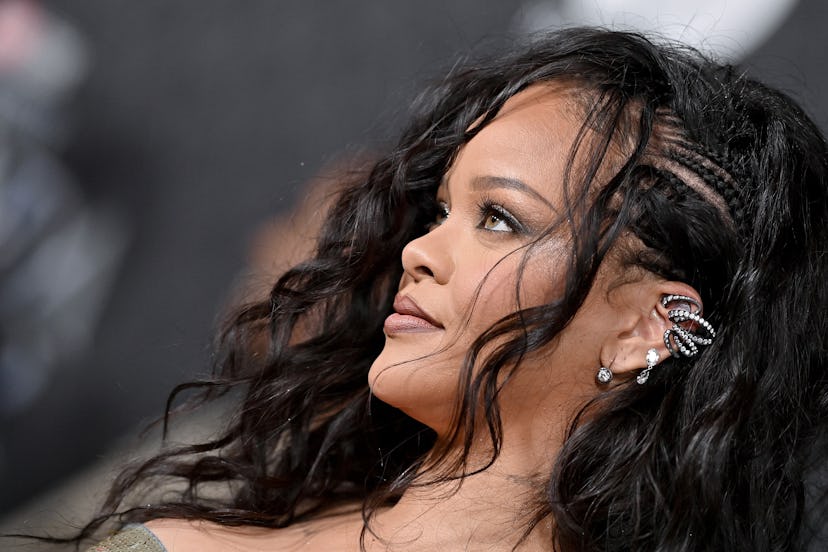 Rihanna in braided hair and lip liner at a movie premiere.