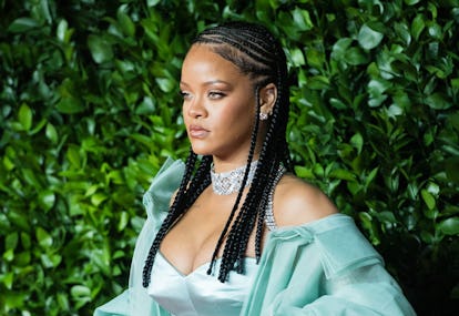 Rihanna wearing braids at a fashion award show in 2019.
