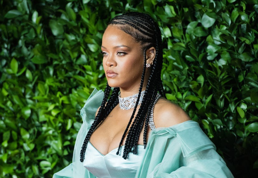 Rihanna wearing braids at a fashion award show in 2019.