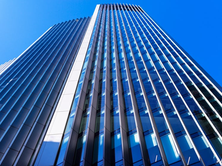 UK, looking up at wall features of an office building in Central London