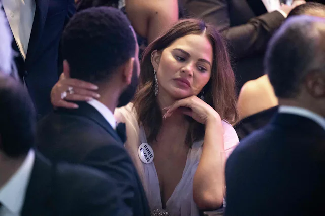 US model and media personality Chrissy Teigen and US musician John Legend attend the White House Cor...