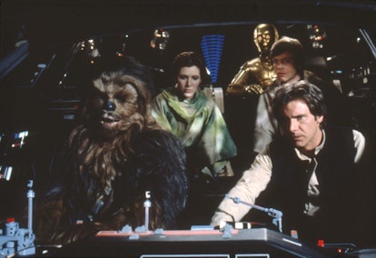 British actors Peter Mayhew, Anthony Daniels, American Carrie Fisher and Harrison Ford on the set of...