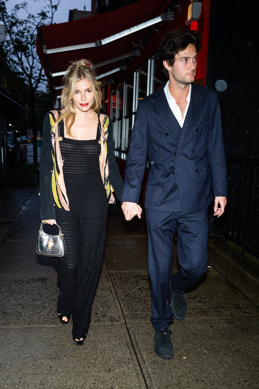 NEW YORK, NEW YORK - APRIL 30: Sienna Miller (L) and Oli Green are seen arriving for a pre-Met Gala ...