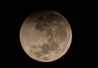 Picture taken during the penumbral phase of a total eclipse of the moon, in Santiago, on May 26, 202...