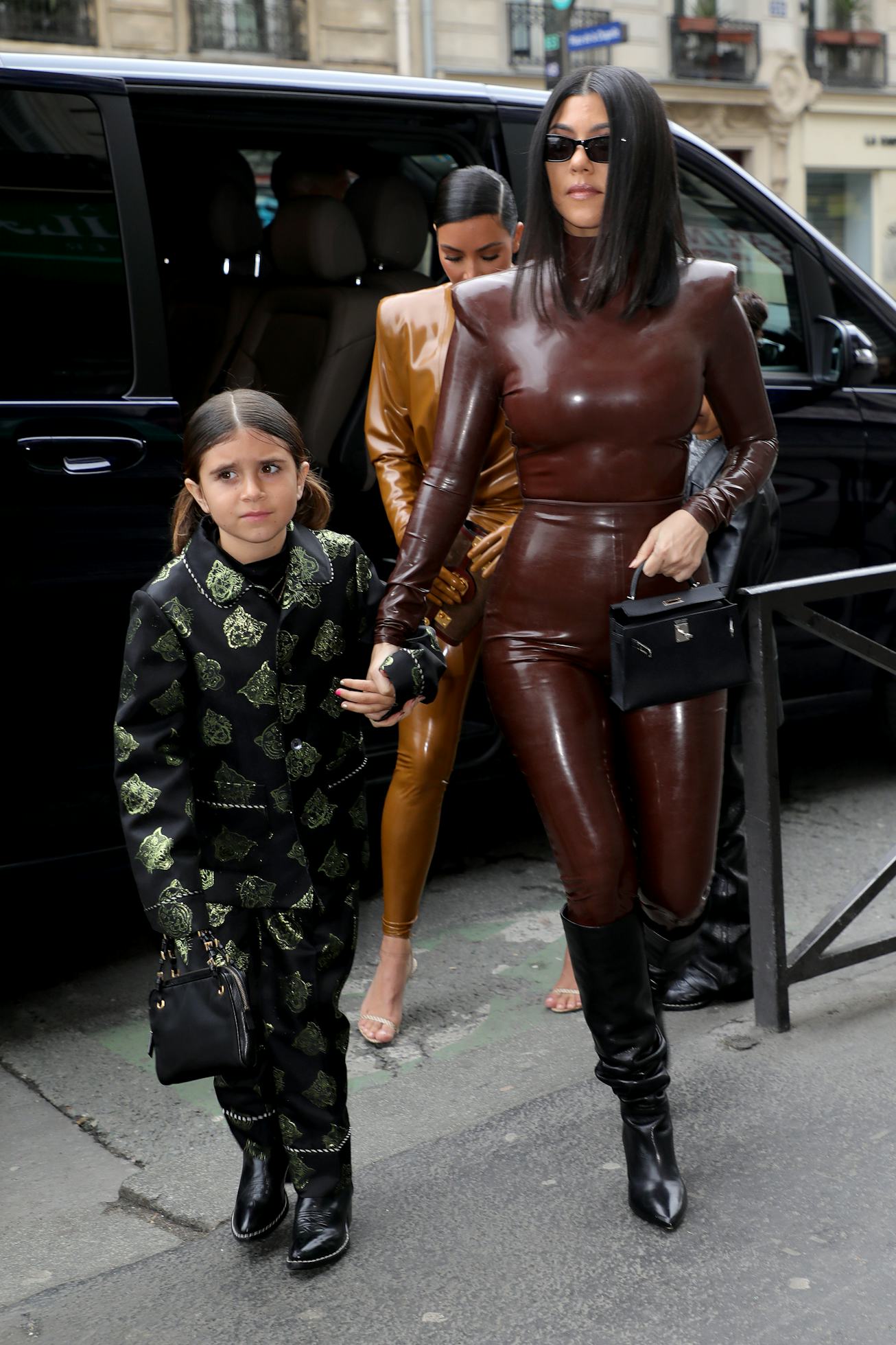PARIS, FRANCE - MARCH 01: Kourtney Kardashian, her daughter Penelope Disick and Kim Kardashian arriv...