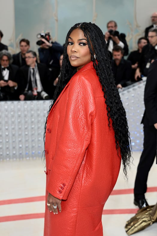 Gabrielle Union at Met Gala 2023 with extra-long hair and red coat