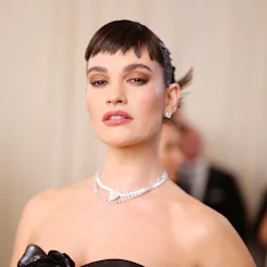 Lily James attends The 2023 Met Gala with new micro bangs.