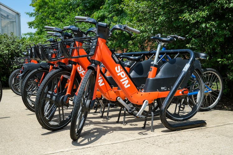 STATE COLLEGE, PENNSYLVANIA, UNITED STATES - 2022/06/15: Spin electric-assist bicycles (e-bikes) are...