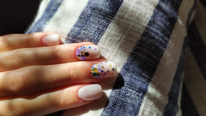 mother's day nail art idea: donut glaze base with sequins in purple and blue