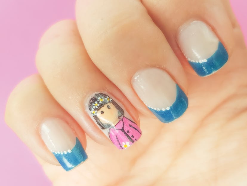 mother's day nail art with blue french tip and a personalized portrait