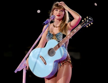 Taylor Swift performing during the Eras Tour to show the Eras Tour surprise song you need to hear, b...