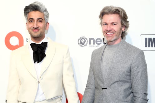LOS ANGELES, CALIFORNIA - FEBRUARY 09: Tan France and Rob France walk the red carpet at the Elton J...