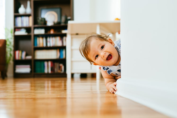 Sweet little baby girl crawling on the floor