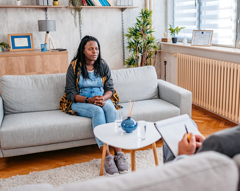 Pregnant woman having a therapy session, describing her prenatal depression struggles.