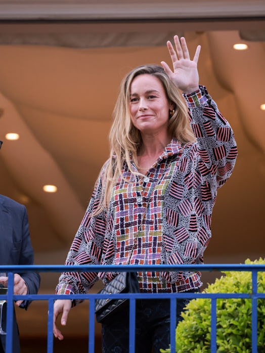  Brie Larson stands on the balcony of the Hotel Martinez