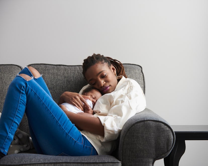 a woman with a newborn in an article about baby blues at night