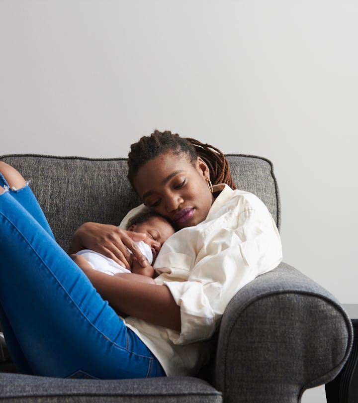 a woman with a newborn in an article about baby blues at night