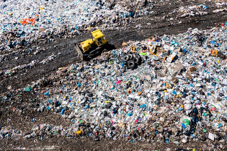 Aerial top drone view of garbage pile, trash dump, landfill, waste from household dumping site. Cons...