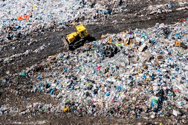 Aerial top drone view of garbage pile, trash dump, landfill, waste from household dumping site. Cons...