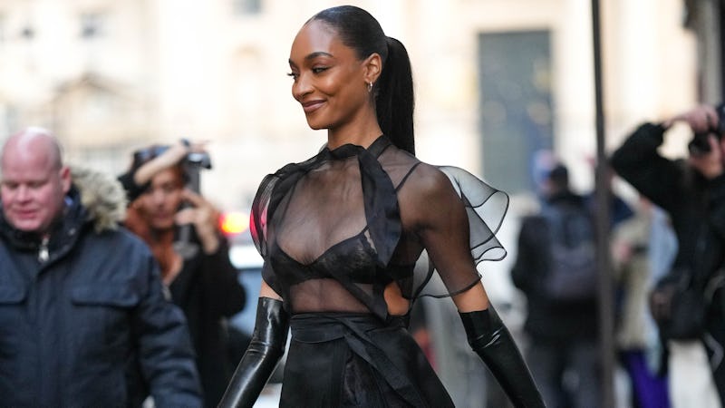 PARIS, FRANCE - MARCH 03: Jourdan Dunn wears diamonds earrings, a black lace prit pattern bra underw...