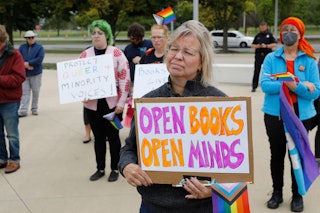 Demonstrators gather to protest against banning books outside of the Henry Ford Centennial Library i...