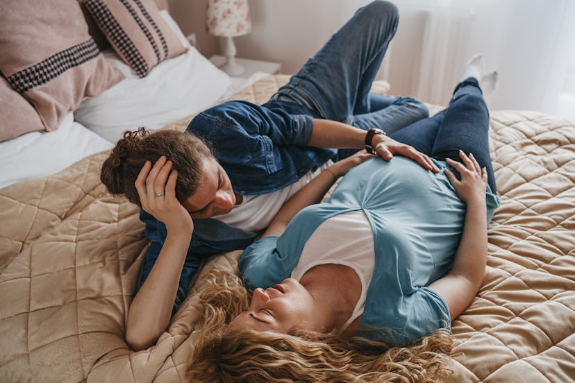 Young pregnant couple resting at home, they can't have sex because she's on pelvic rest