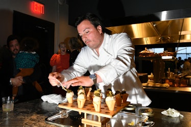 NEW YORK, NEW YORK - MAY 18: Chef Yann Nury prepares food during W Magazine dinner in celebration of...