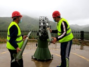 SHIJIAZHUANG, CHINA - MAY 15: Workers of local meteorology bureau fire a cloud-seeding rocket in an ...