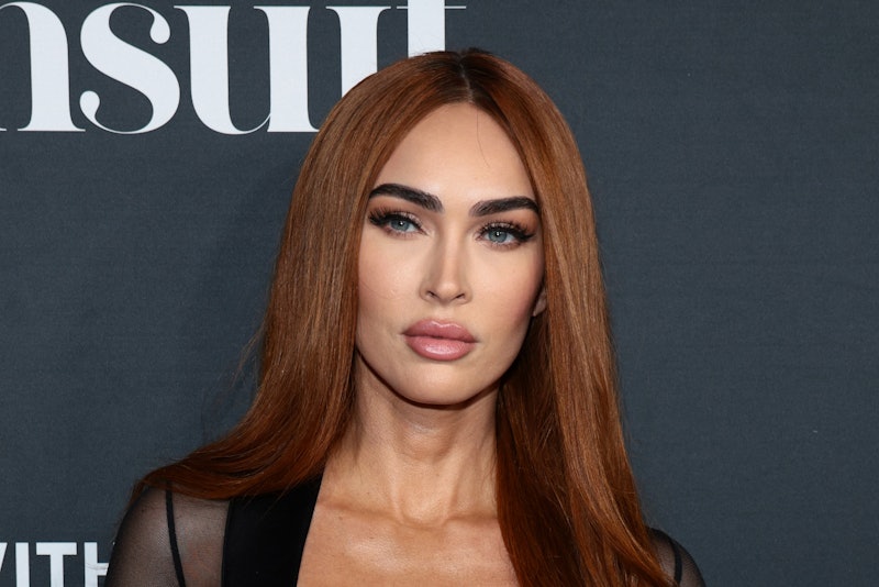 Megan Fox wore a sheer low-cut black dress at 'Sports Illustrated Swimsuit' launch with Machine Gun ...